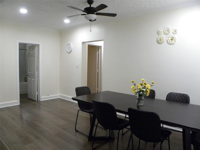 dining room with dark wood-style flooring, crown molding, recessed lighting, a ceiling fan, and baseboards