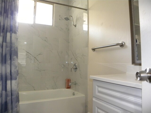 bathroom with shower / bath combo with shower curtain and vanity