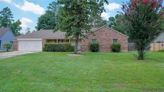 single story home with a garage and a front lawn