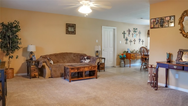 carpeted living room featuring ceiling fan