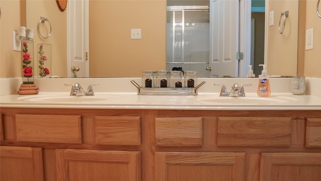 bathroom with walk in shower and vanity