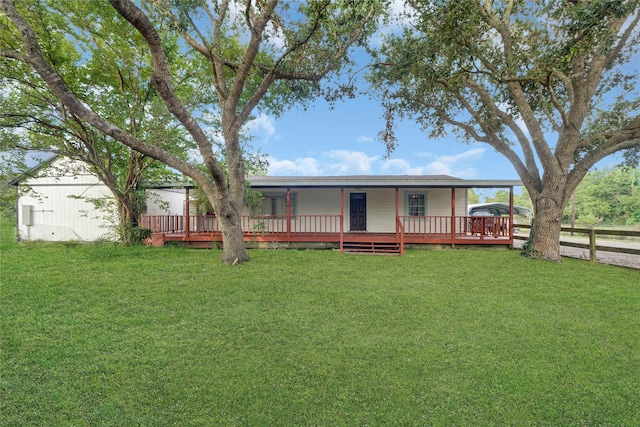 exterior space with a yard and a deck