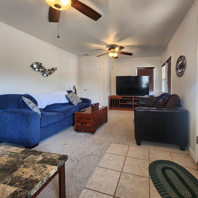 carpeted living room featuring ceiling fan