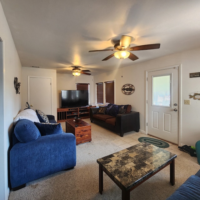 living room with ceiling fan and light colored carpet