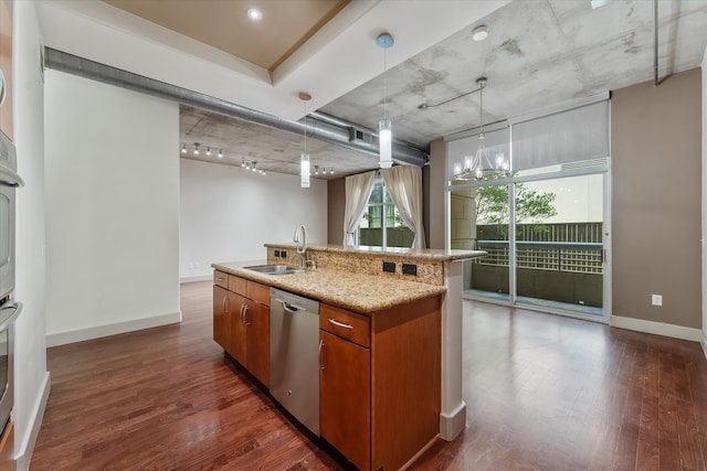 kitchen featuring dark hardwood / wood-style flooring, a kitchen island with sink, track lighting, stainless steel dishwasher, and sink