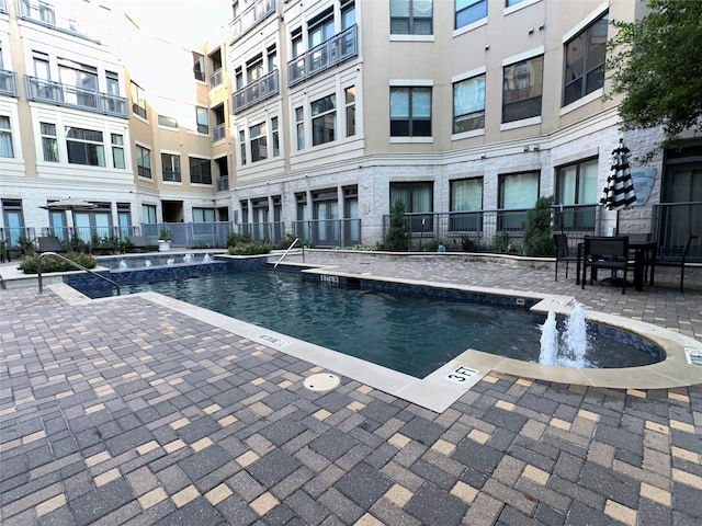 view of pool featuring pool water feature