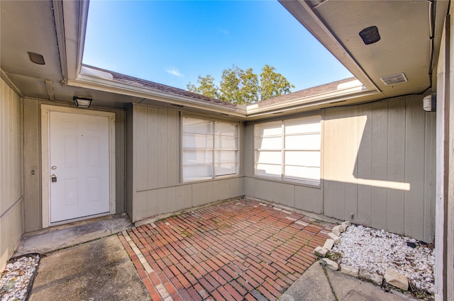 entrance to property with a patio area