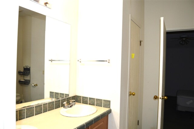 bathroom with vanity and toilet