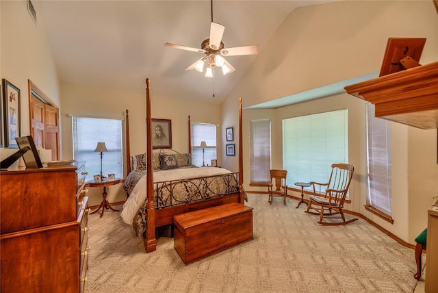 bedroom featuring high vaulted ceiling, light carpet, and ceiling fan