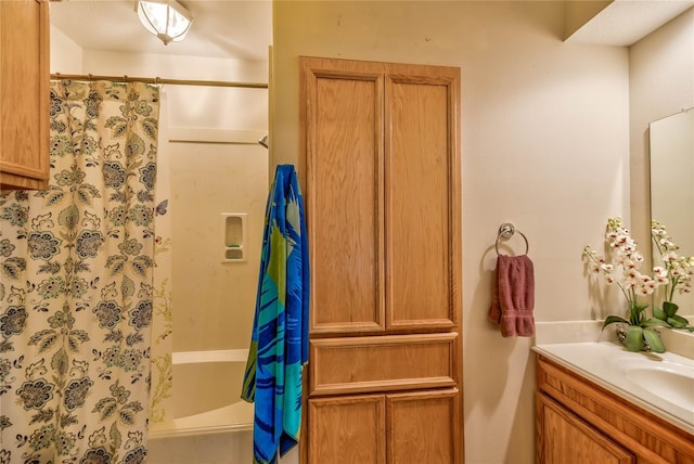 bathroom featuring shower / bath combination with curtain and vanity