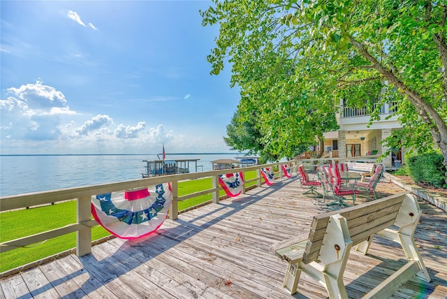 wooden deck featuring a water view