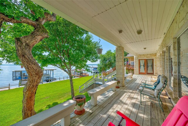 wooden deck featuring a yard