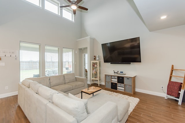 living room with ceiling fan, a healthy amount of sunlight, and hardwood / wood-style flooring