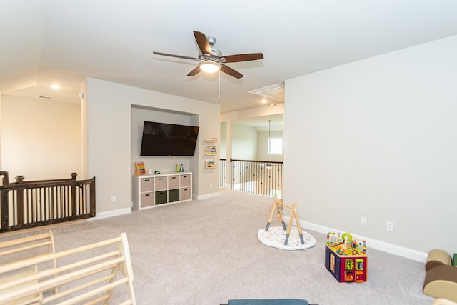 carpeted living room featuring ceiling fan