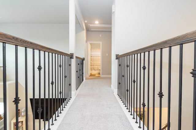 corridor featuring light colored carpet