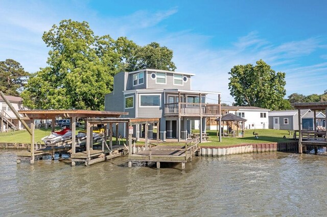 exterior space with a lawn and a water view