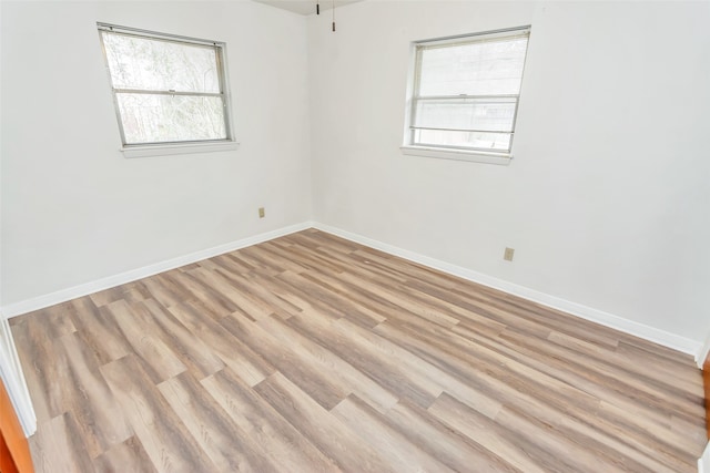 empty room featuring hardwood / wood-style floors