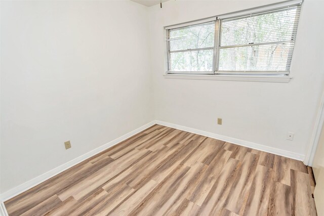 empty room featuring hardwood / wood-style flooring