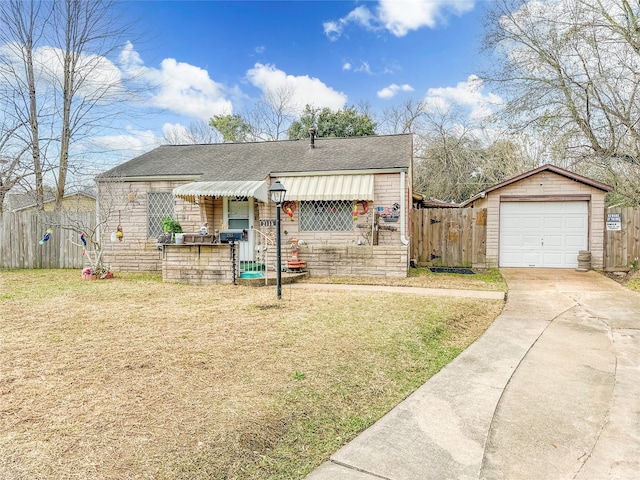 view of front of home with a front yard and a garage