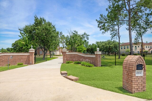 view of property's community with a lawn