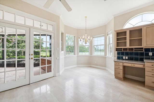 unfurnished office with french doors, light tile patterned floors, ceiling fan with notable chandelier, and ornamental molding