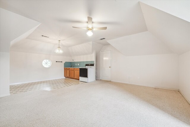 additional living space featuring ceiling fan with notable chandelier, light colored carpet, and lofted ceiling