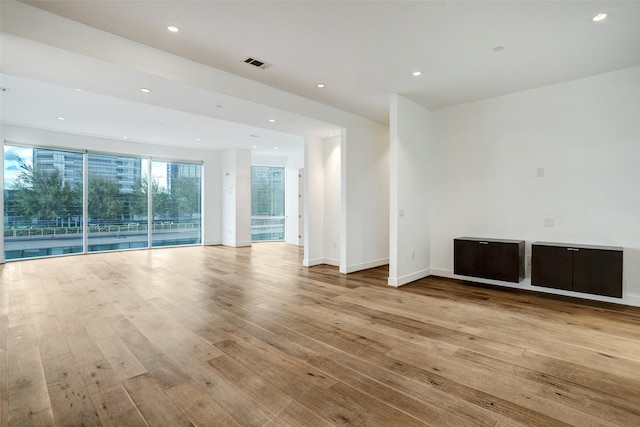 unfurnished room featuring light hardwood / wood-style floors