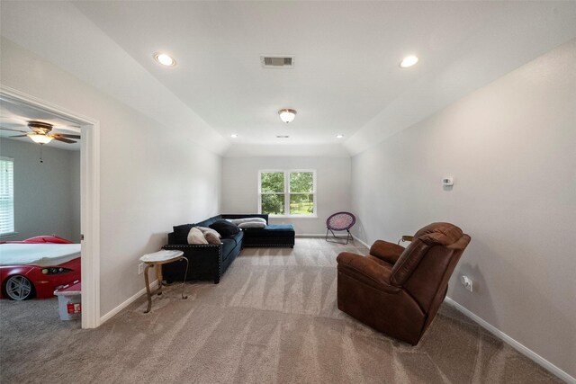 interior space with ceiling fan and vaulted ceiling