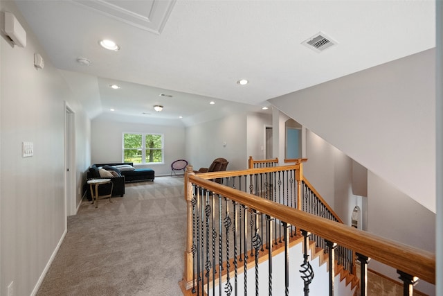 hall with carpet and lofted ceiling