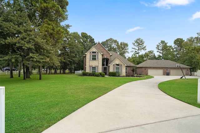 view of front of property with a front lawn and a garage