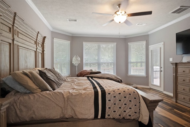 bedroom featuring ceiling fan, ornamental molding, access to exterior, and dark hardwood / wood-style floors