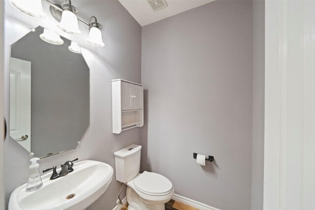 bathroom featuring sink and toilet