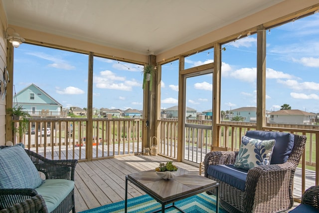 sunroom / solarium featuring plenty of natural light