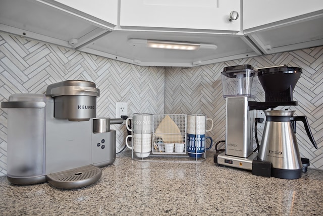 kitchen with white cabinets and stone counters