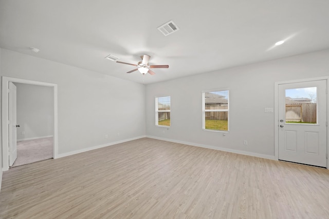 unfurnished living room with ceiling fan and light hardwood / wood-style flooring