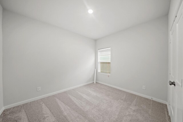 unfurnished room featuring carpet floors