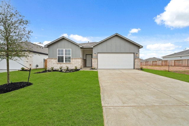 view of front facade with a garage and a front lawn