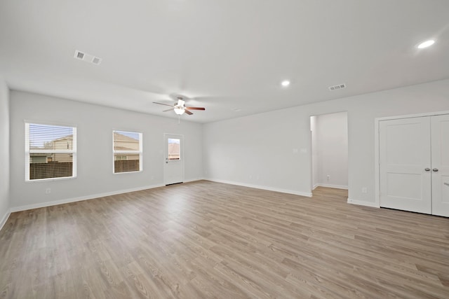 spare room with ceiling fan and light hardwood / wood-style floors