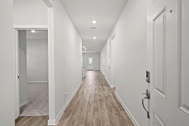 corridor featuring light hardwood / wood-style flooring