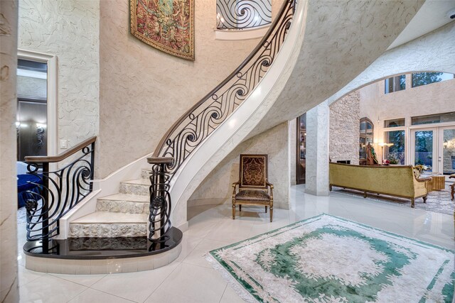 stairway featuring french doors