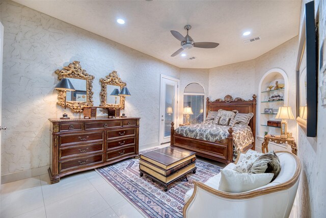 tiled bedroom featuring ceiling fan