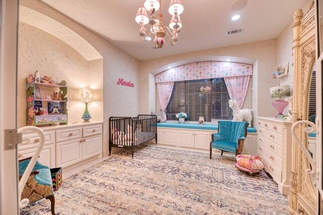 sitting room with an inviting chandelier