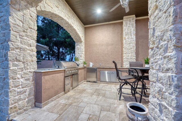 view of patio / terrace featuring grilling area, ceiling fan, and area for grilling