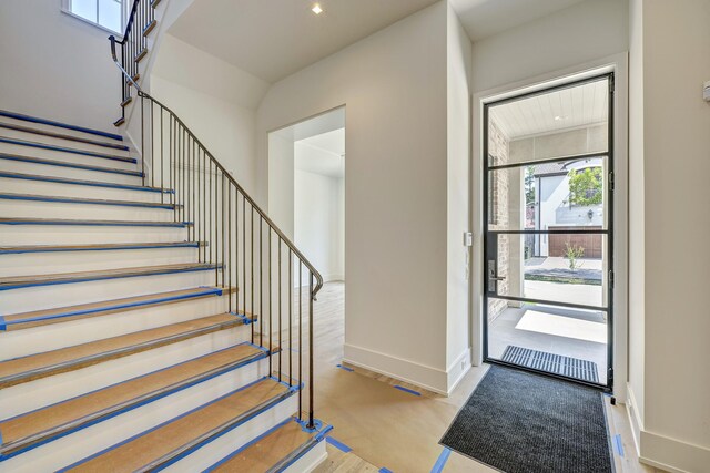 staircase featuring hardwood / wood-style floors