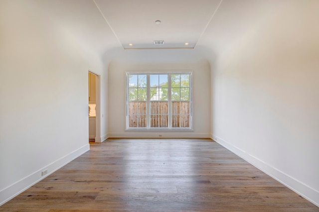 spare room featuring hardwood / wood-style floors