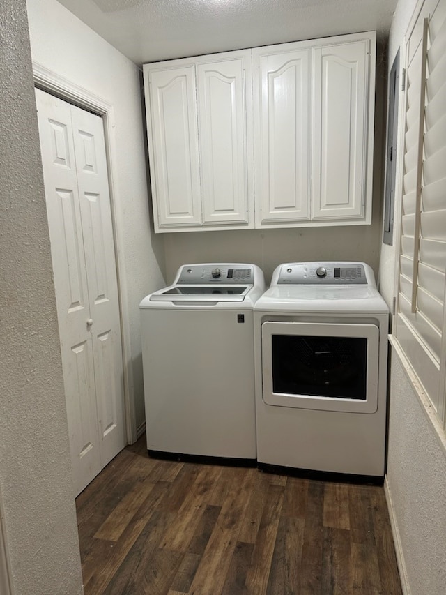 laundry area with cabinets, independent washer and dryer, dark hardwood / wood-style flooring, and a textured ceiling