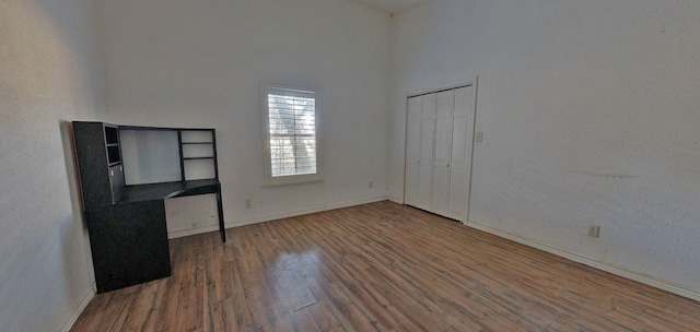 unfurnished room featuring dark hardwood / wood-style flooring