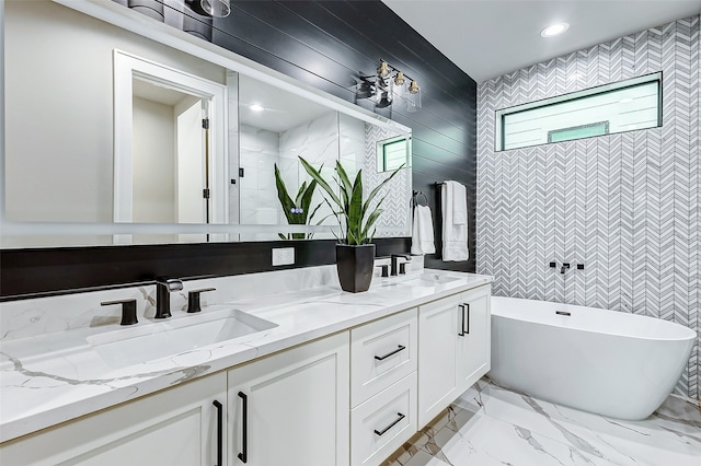 bathroom featuring vanity and shower with separate bathtub