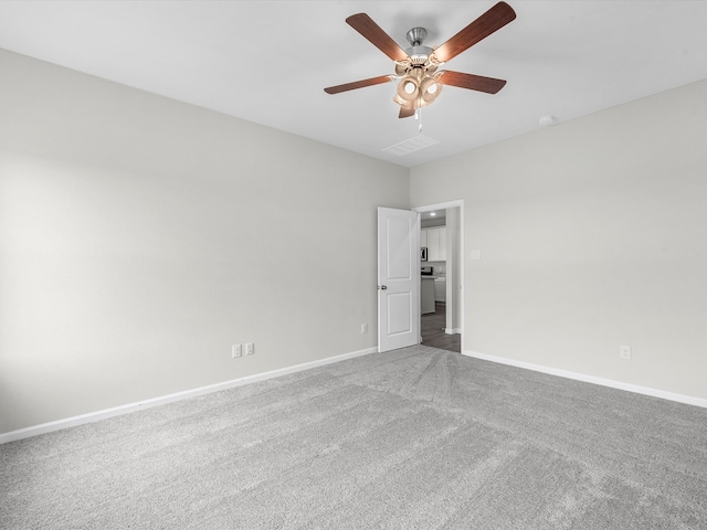 carpeted empty room with ceiling fan