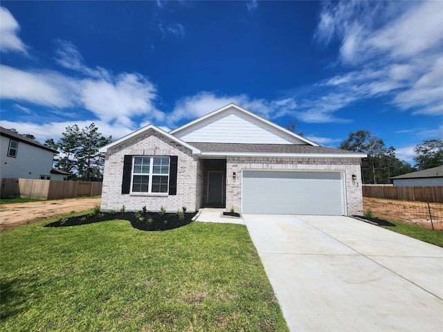 view of front of home with a garage and a front yard